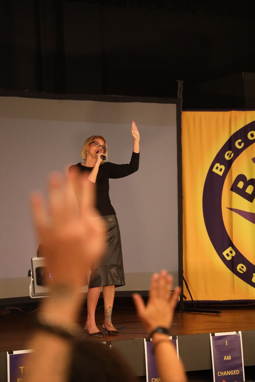 Stacy Raske engaging an audience from the stage