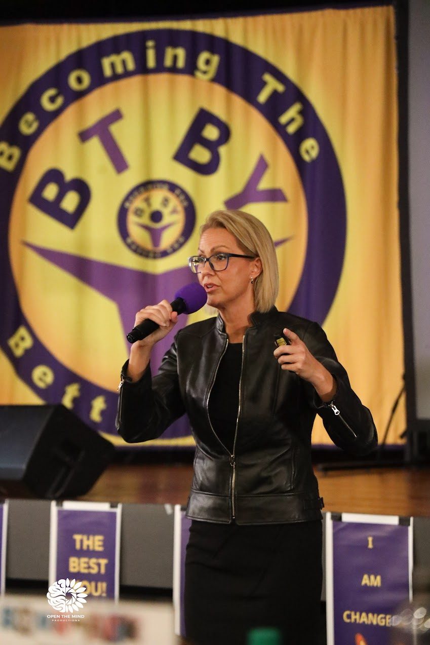 Stacy Raske speaking on stage
