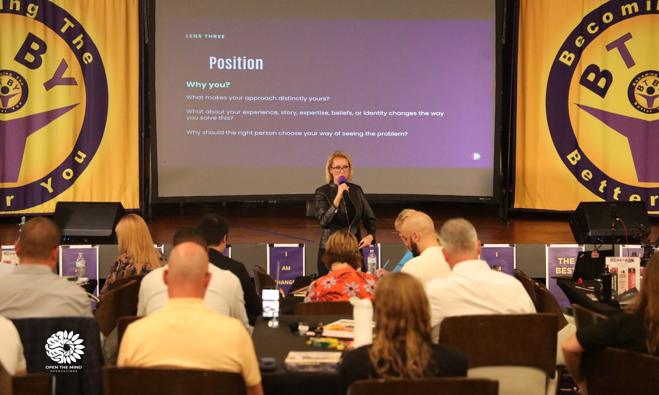 Stacy Raske teaching a room, with a slide titled Position